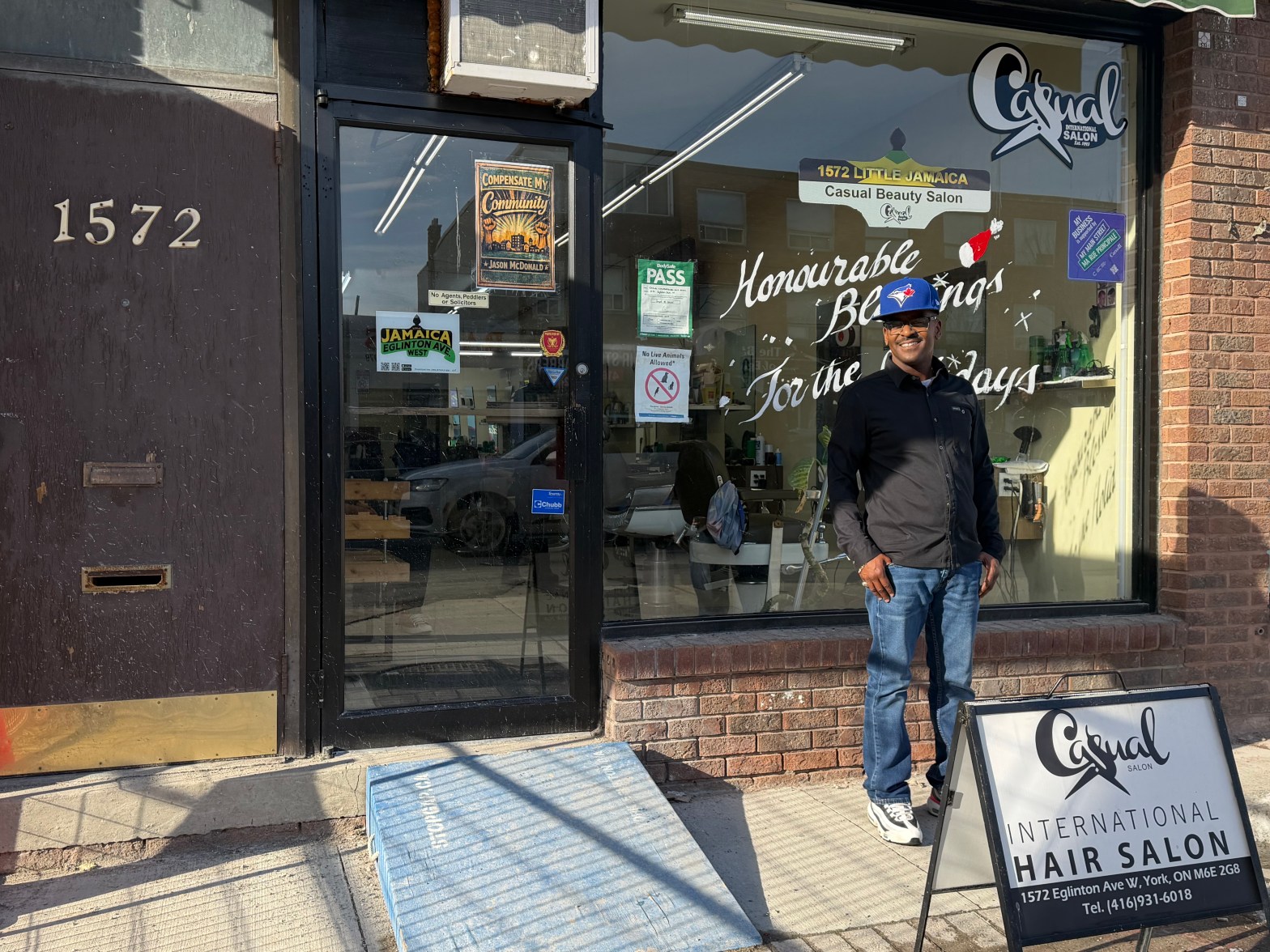 A man in front of a shop.